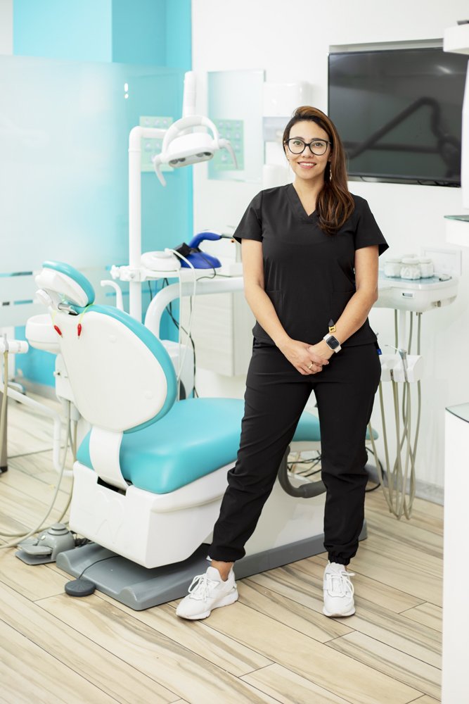 Dentist Standing Smiling Looking Camera His Medical Office